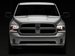 Raxiom 09-18 Dodge RAM 1500/2500/3500 Axial Series Headlights w/ LED Bar- Blk Housing (Clear Lens)