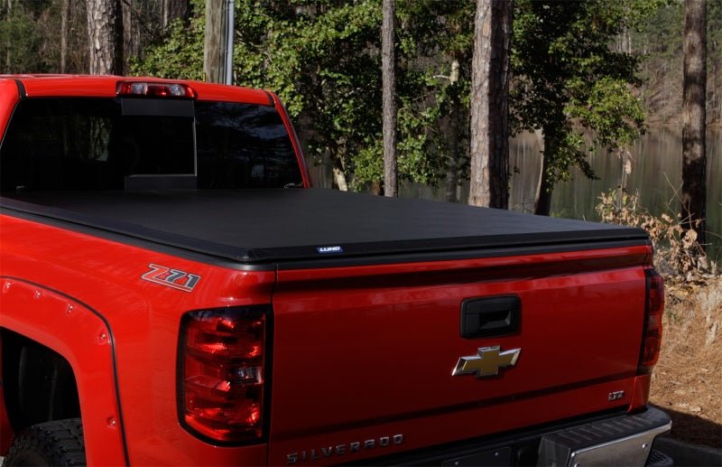 LUND - Lund 04 - 15 Nissan Titan (5.5ft. Bed) Hard Fold Tonneau Cover w/Bracket Kit - Black - Demon Performance
